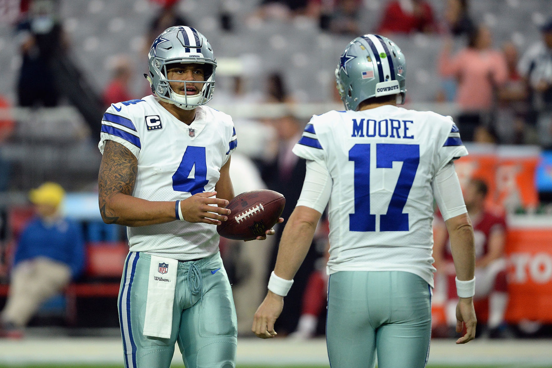 Dallas Cowboys quarterbacks Dak Prescott (4) and Kellen Moore (17) talk before the start of a game against the Arizona Cardinals at the University of Phoenix Stadium in Glendale, Ariz., on September 25, 2017. (Jennifer Stewart/Getty Images/TNS) **FOR USE WITH THIS STORY ONLY**